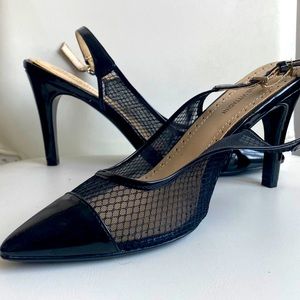 Black mesh and patent leather pointed toe heels